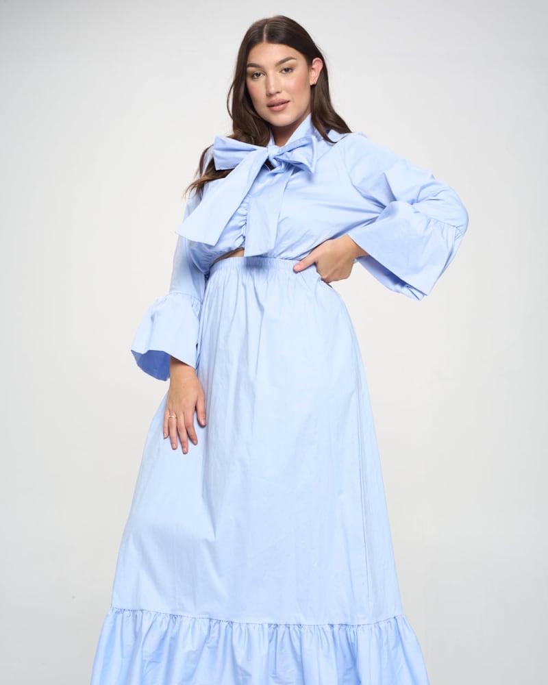 Front of a model wearing a size 3X Poplin Bell Sleeve Top and Skirt Set in Periwinkle by L I V D. | dia_product_style_image_id:240889